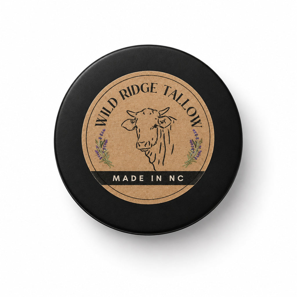 A round black container of Mild Ridge Tall Oil with a tan label featuring a cow illustration and the text 'MADE IN NC', placed on a white marble countertop.