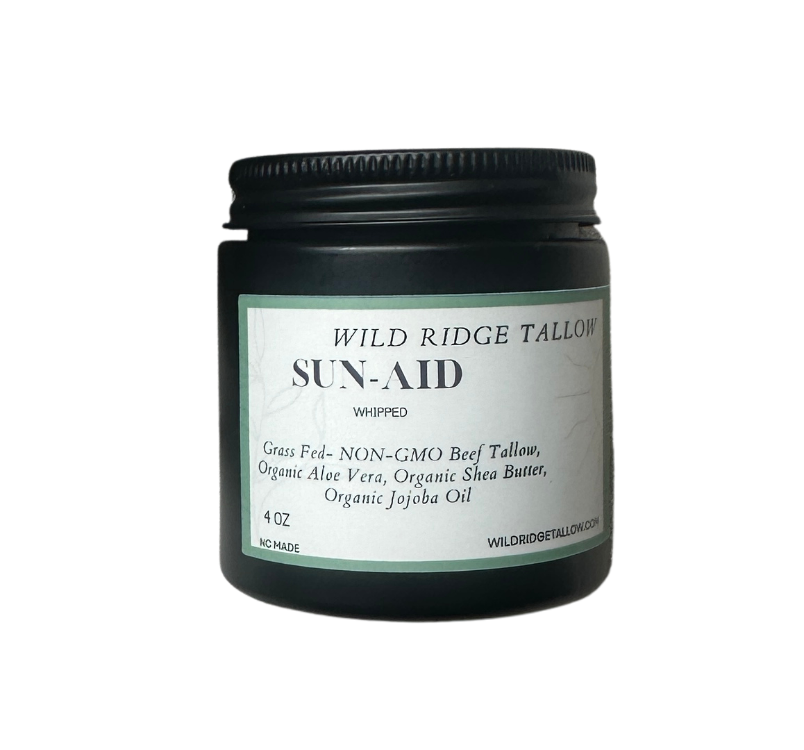 Black jar of Wild Ridge Tallow Sun-Aid on a white background